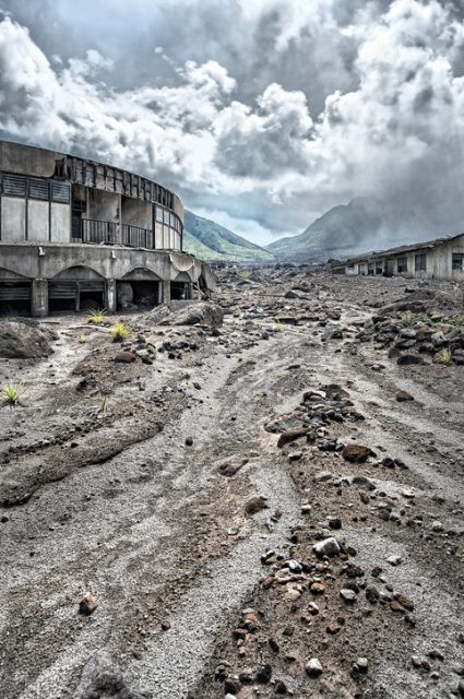 The volcano still fumes, with its strong sulfur contents making any prolonged presence of humans impossible.