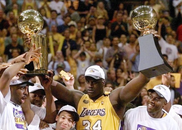 Shaq holding a trophy