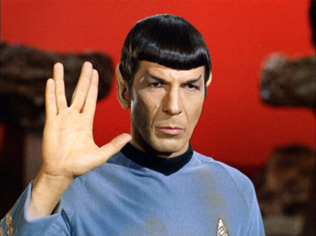 Nimoy greeting the photo with a Vulcan salute