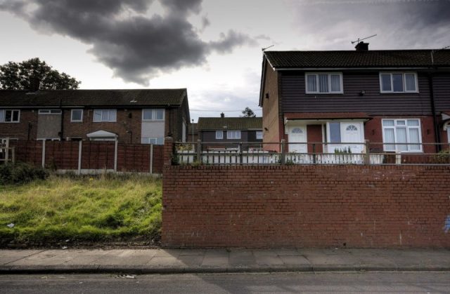 The empty plot where 16 Wardle Brook Avenue in Hattersley once stood. Manchester City Council decided in 1987 to demolish the house. Author:Parrot of Doom – CC BY-SA 3.0