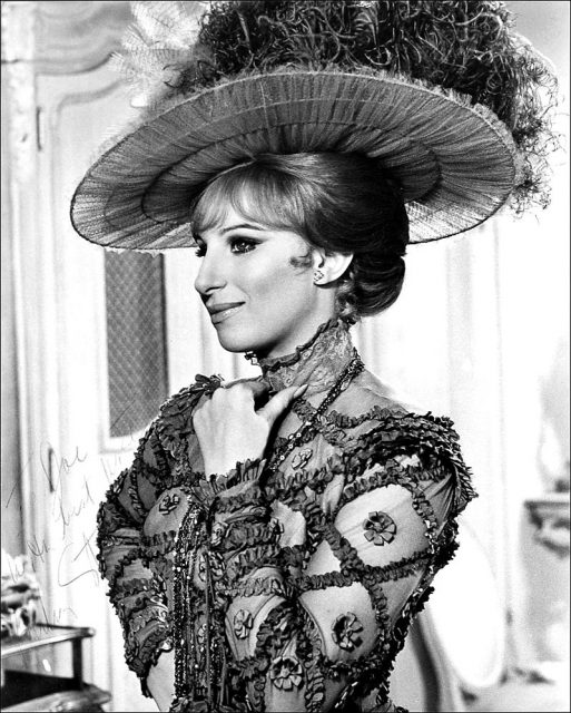 Autographed posed publicity photo of Barbra Streisand for film Hello Dolly.