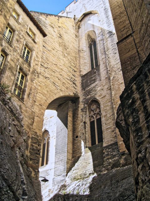 Avignon, France – July 29, 2017: Detail of the Palais des Papes is the papal residence. Papal palace is one of the largest and most important medieval gothic buildings in Europe. UNESCO World Heritage Site.