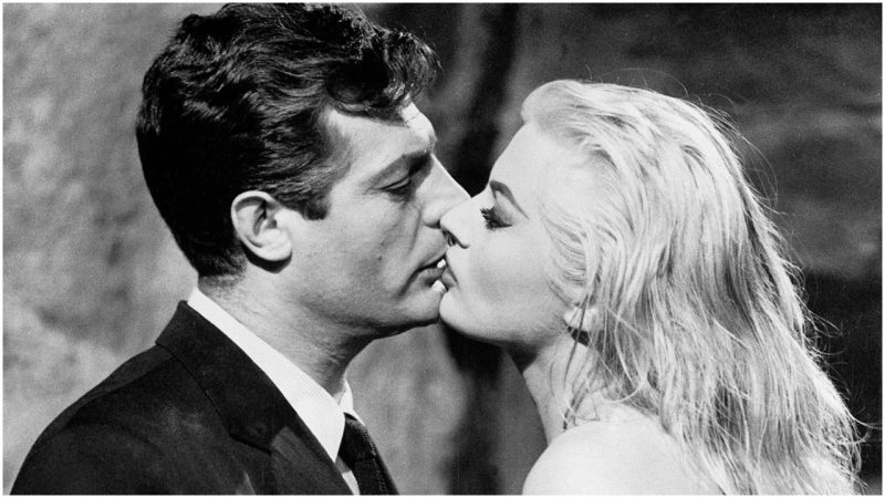 Italian actor Marcello Mastroianni (1924 - 1996), as Marcello Rubini, and Swedish-American actress Anita Ekberg as Sylvia, kissing, in 'La Dolce Vita', directed by Federico Fellini, 1960. (Photo by Silver Screen Collection/Getty Images)