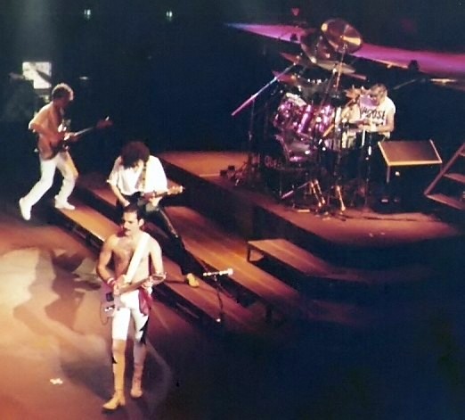 Mercury playing rhythm guitar during a live concert with Queen in Frankfurt, Germany, 1984. Photo by Thomas Steffan CC BY-SA 3.0