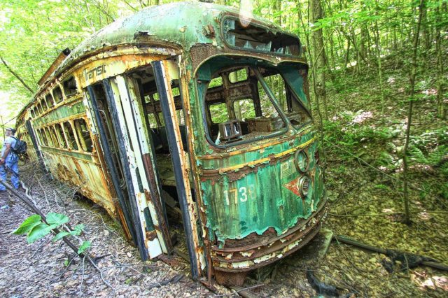 The trains were collected by a retired civil engineer who spent his career with the Army Corp of Engineers. He purchased a lot of these streetcars starting in the 1980s. Author: Forsaken Fotos, CC BY 2.0