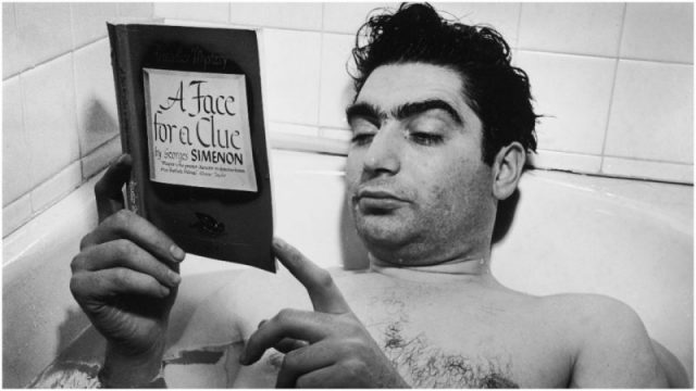 Hungarian-born photographer and journalist Robert Capa (1914 – 1954) reads George Simenon’s ‘A Face for a Clue’ (also known as ‘Le chien jaune’) while he lies in a bathtub at the home of fellow photographer, Myron Davis, New York, New York, October 1942. Photo by Myron Davis/The LIFE Images Collection/Getty Images
