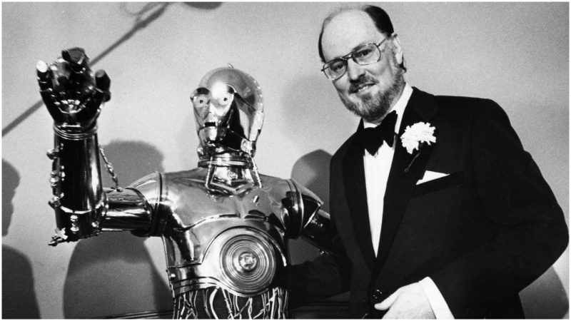  Conductor John Williams poses with C3P0 at a press conference after the Boston Pops on April 29, 1980. (Photo by Janet Knott/The Boston Globe via Getty Images)