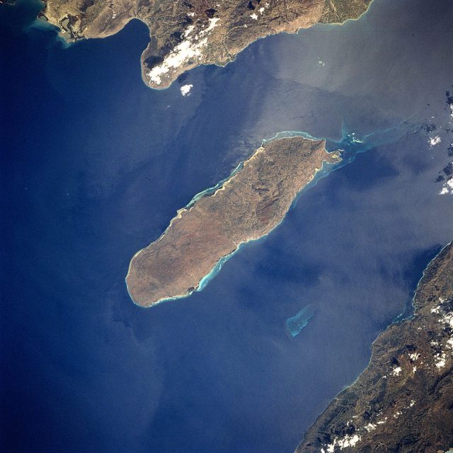 Gonâve Island, in the Gulf of Gonâve, Haiti. The Rochelois Bank is faintly discernible in the southerly channel between the island and the mainland.