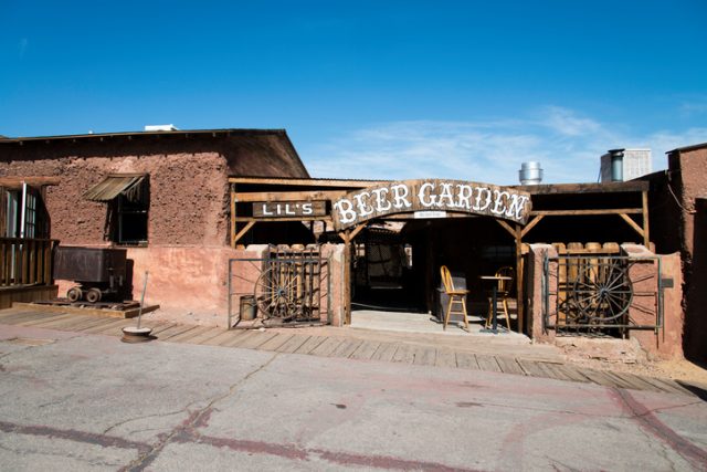 Calico, United States – June 3, 2014: View at the main street in the Calico ghost town in the desert of California very close to Nevada. Calico is an old west mining touristic village that has been around since 1881. Image taken during daytime.