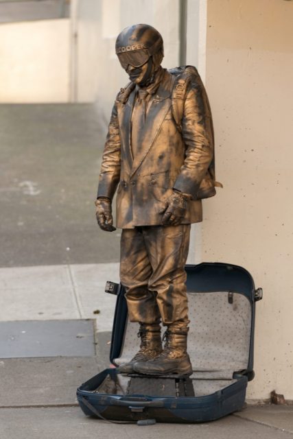 A man dressed up like D.B. Cooper in Pike Place Market, Seattle.