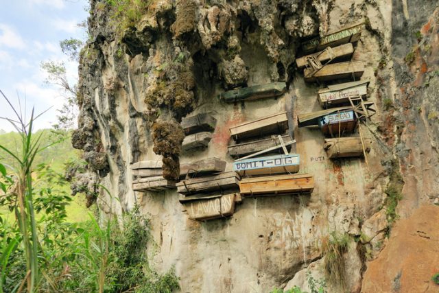 Philippinos in the mountain region of Sagada used to hang coffins with their dead down a cliff as a burial tradition in Echo Valley, Sagada, Northern Luzon, Philippines