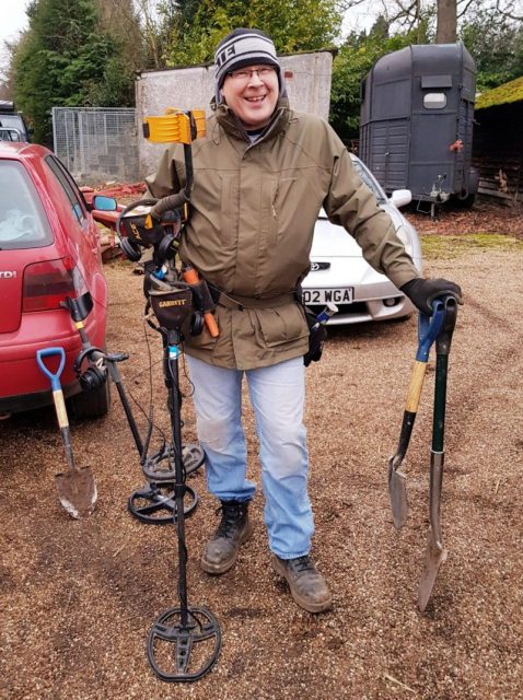 Paul Adams with a metal detector. Photo by: Andy Sampson