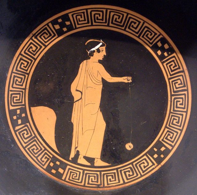 Boy playing yo-yo. Tondo of an Attic red-figure kylix, ca. 440 BC.