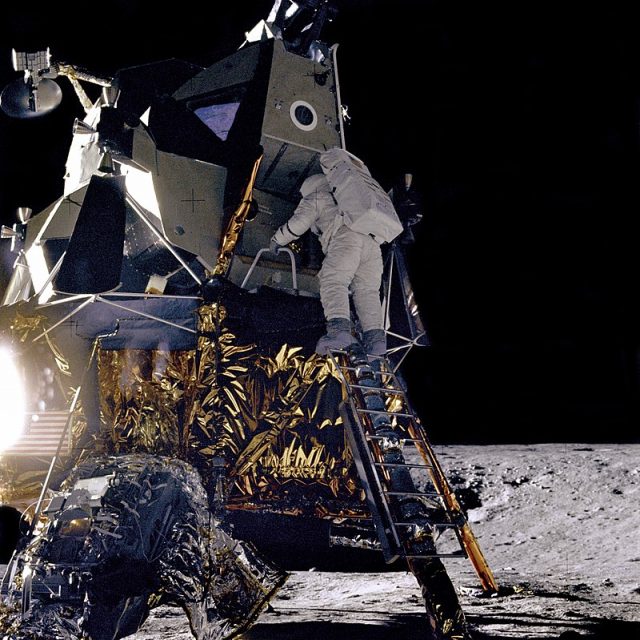 Alan L. Bean, Lunar Module pilot for the Apollo 12 mission, starts down the ladder of the Lunar Module (LM) “Intrepid” to join astronaut Charles Conrad, Jr., mission Commander, on the lunar surface.