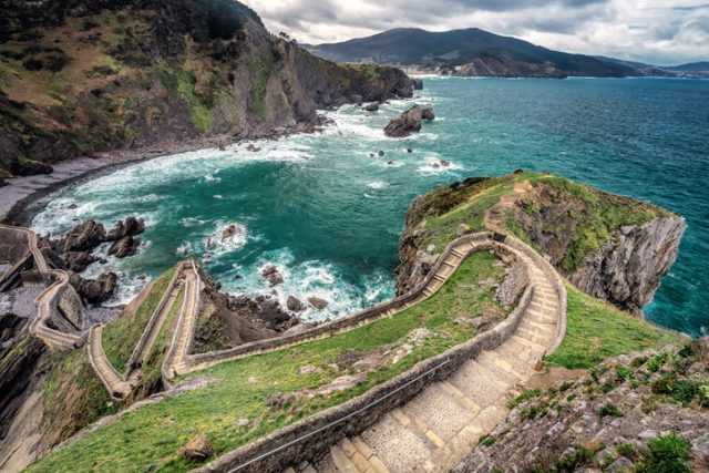 San Juan de Gaztelugatxe church is dedicated to John the Baptist, connected to the mainland by a man-made bridge, Bermeo, Basque Country, Spain.