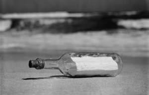 Message in bottle on shore