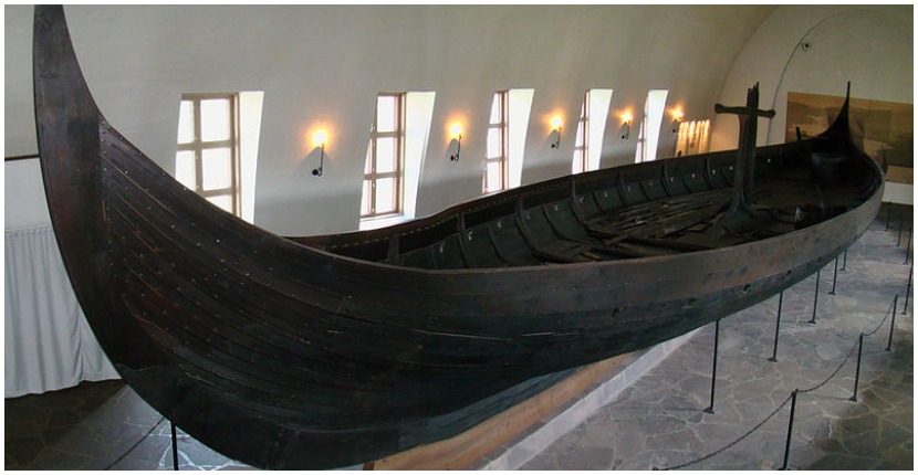 The Gokstad Ship in the purpose-built Viking Ship Museum in Oslo, Norway. The ship is 24 meters long and 5 metres wide, and has room for 32 men with oars to row. Photo by Bjørn Christian Tørrissen CC by SA-3.0