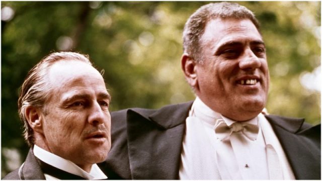 American actors Marlon Brando (1924 – 2004) (left) (as Don Vito Corleone) and Lenny Montana (1926 – 1992) (as Luca Brasi) in a scene from ‘The Godfather’ (directed by Francis Ford Coppola), New York, New York, 1972. (Photo by Silver Screen Collection/Getty Images)
