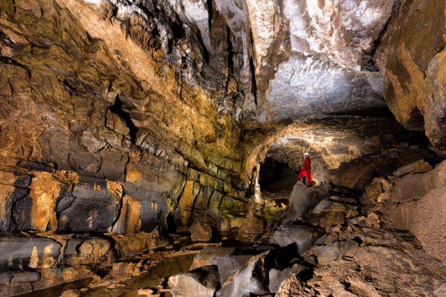 Young male caver posing