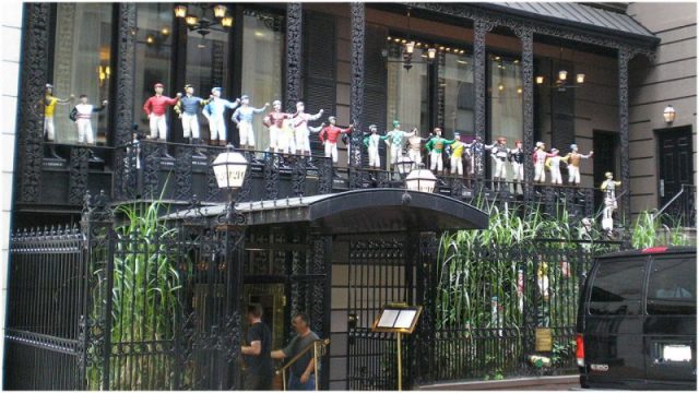 The entrance the 21 Club in Manhattan uses 33 jockeys to welcome its patrons. Photo: David Shankbone – CC BY 2.5