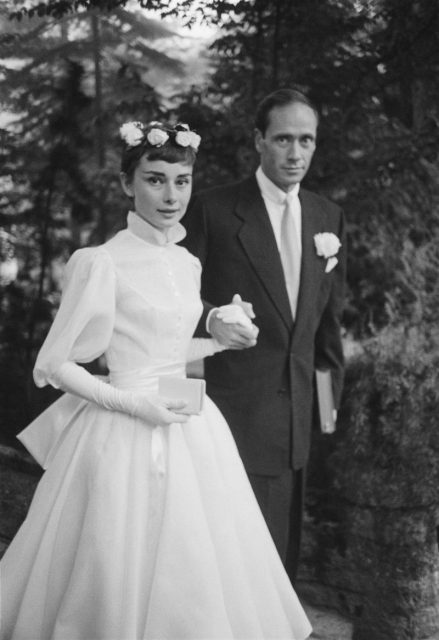 Audrey Hepburn (1929 – 1993) and Mel Ferrer on their wedding day. Dress designed by Balmain. Photo by Ernst Haas/Ernst Haas/Getty Images