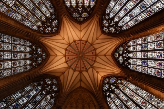 “Abstract wide angle – looking up at the octagonal ceiling and stained glass windows of York Minster Chapter House built between 1260 and 1280 ADYork, England, UK”