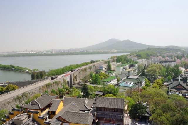 “Bird-eye view of Ming City Wall with Xuanwu Lake on left and Purple Gold Mountain in the background, Nanjing, China”