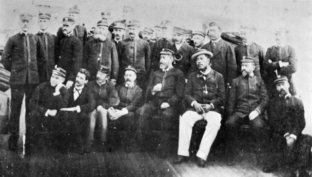 Kalākaua (in white slacks) aboard the USS Charleston en route to San Francisco