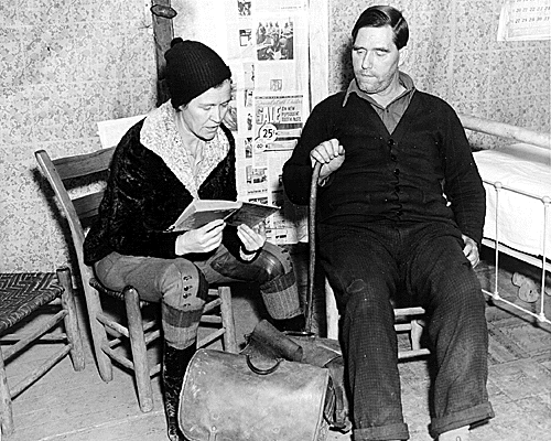 A pack horse librarian reads aloud to a man in the Kentucky mountains.