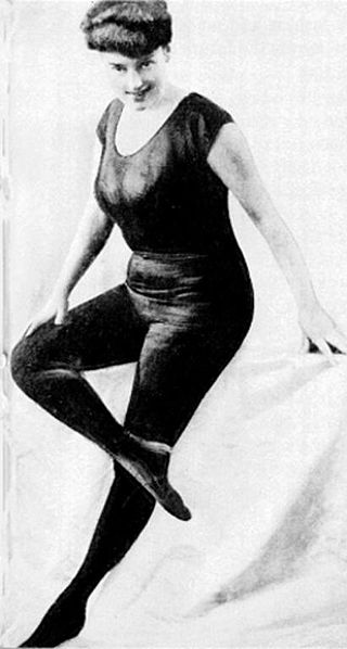 A 1906 caption of Australian swimmer and actress Annette Kellerman. Here she poses in her self-designed Black Diving Suit.