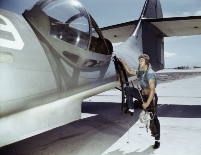 Aviation Ordnance Mate Jesse Rhodes Waller is all set to place a machine gun in one of the Navy’s PBY planes.