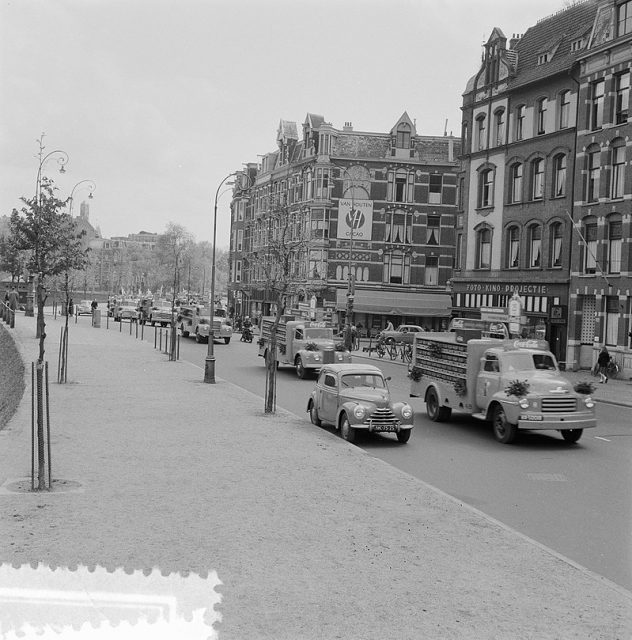 A fleet of Coca-Cola trucks making their way through the city.