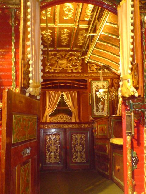 Interior of a Reading wagon, as used by the British Romani (Romanichal), donated to a museum by a family from Rhu, Scotland. Photo by Sunset through the clouds