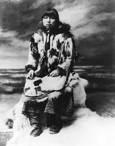An Inuit woman draped in fur parka, Alaska, ca 1901