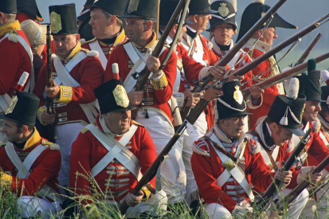 Soldiers in a defending position at the historical battle of Waterloo in Belgium, reenacting the famous clash. Waterloo, Belgium – June 18,2011.