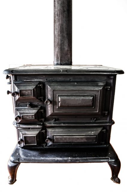 A black antique cook stove.