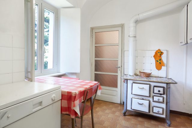 A vintage style oven in a kitchen in Italy.