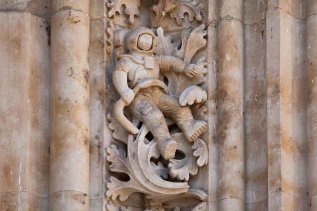 Salamanca, Spain – 25 May 2015: The famous astronaut carved in stone in the Salamanca Cathedral Facade. The sculpture was added during renovations in 1992.