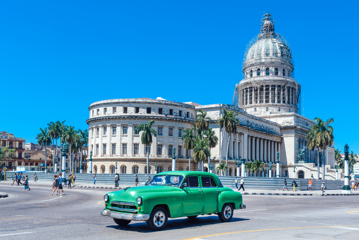The unique combination of old American cars and grand Spanish colonial buildings can only be experienced in Havana, Cuba.