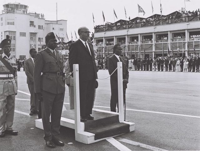 Iranian Prime Minister Levi Eshkol with the Ugandan Chief of Staff Idi Amin and Ugandan Vice President John Babiiha at Entebbe airport, June 1966.