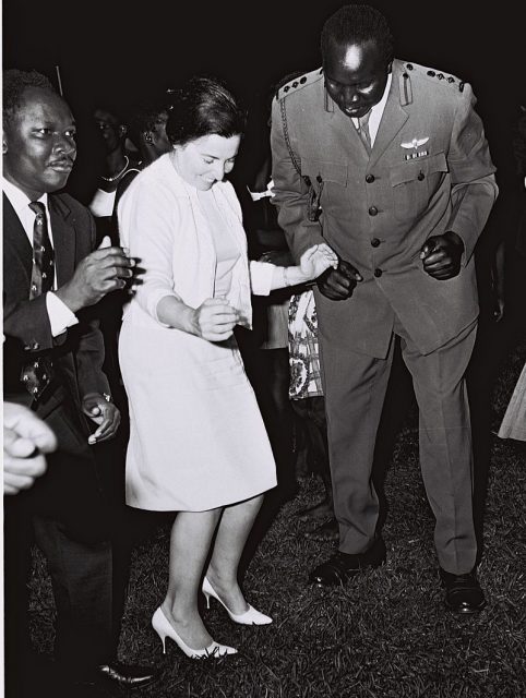 Mrs. Miriam Eshkol joining Ugandan Foreign Minister Sam Odaka and Chief of Staff Idi Amin in a tribal dance during a party given for Israeli Prime Minister Levi Eshkol at Jinja Military Camp, Uganda.