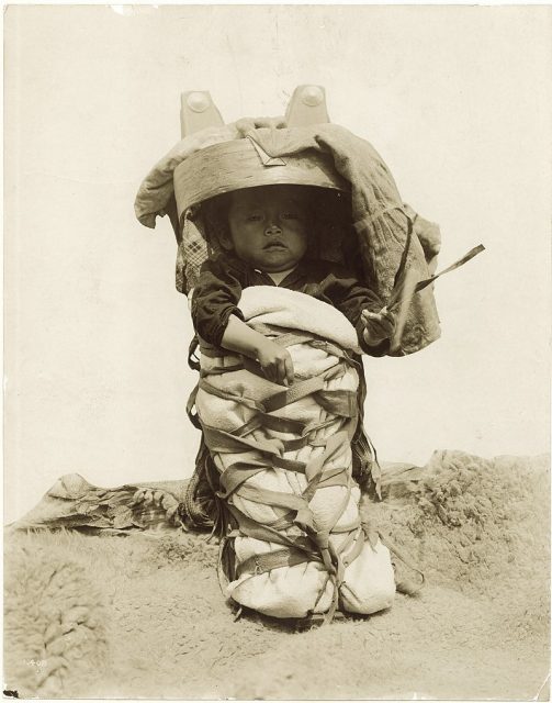 Navajo child and cradle board, from the Arizona Department of Anthropology exhibit at the 1904 World’s Fair.