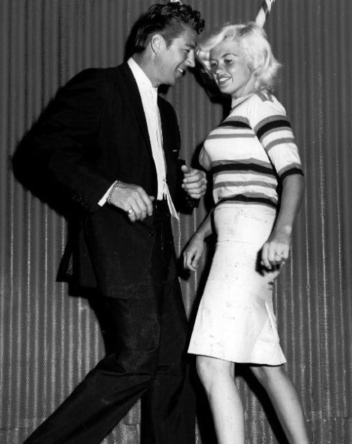 Photo of Jayne Mansfield and husband Mickey Hargitay dancing at the Candy Stik Lounge.
