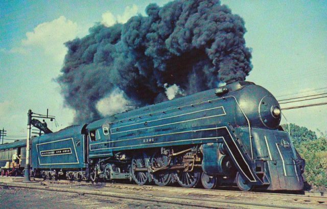 Some huge dark clouds released by the streamliner steam locomotive of the Baltimore and Ohio train, the Cincinnati.