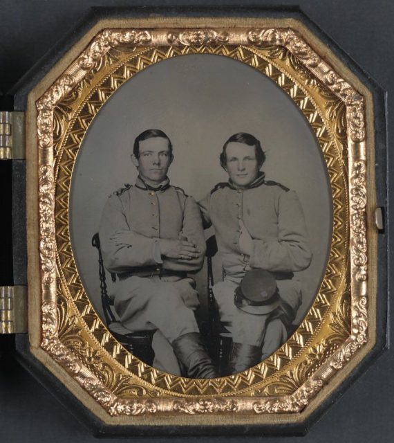 Pvt. Reggie T. Wingfield and Pvt. Hamden T. Flay in Confederate uniforms.