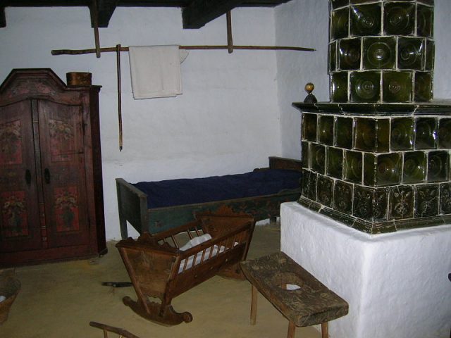 Göcsej Village Museum, Zalaegerszeg, Hungary. Reconstruction of a room in an old peasant house, including a cradle.