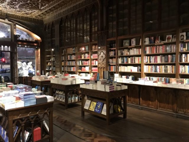 The staff of Livraria Lello still use an old-fashioned cart to move the books around – it runs on the narrow track visible on the floor in this picture.