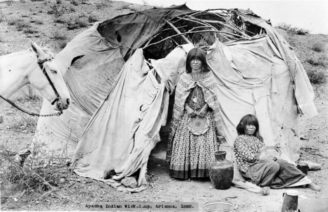 Two women photographed next to their cloth covered wickiup, Arizona, 1800.