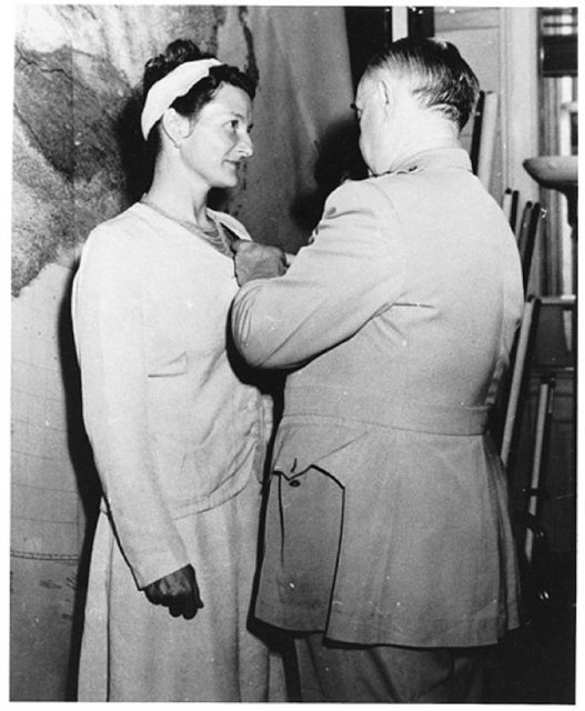 Virginia Hall of Special Operations Branch receiving the Distinguished Service Cross from General Donovan, September 1945.
