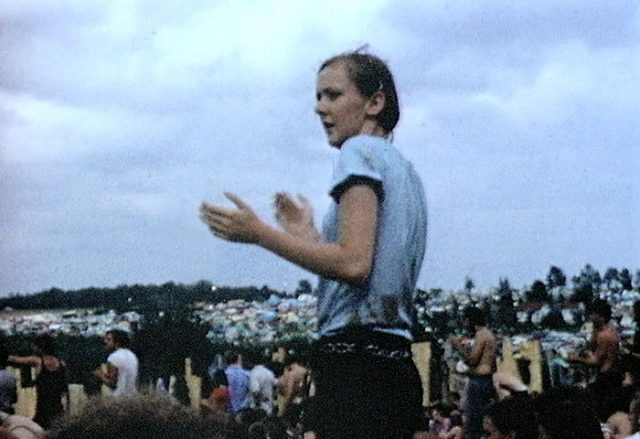Audience member dances on Saturday night at the Woodstock Festival. Photo by Derek Redmond CC BY-SA 3.0